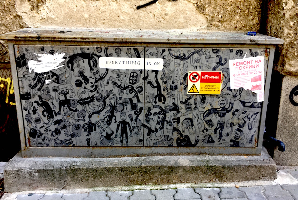Street art that says "everything is okay" on a power box