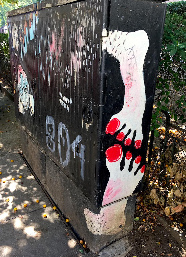 Street art of red painted toes